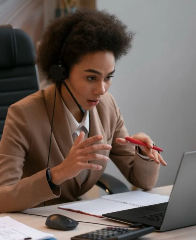A NewFlow Immigration consultant reviewing a client's refused application during a consultation